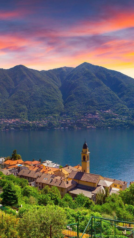 Colorful summer sunrise on the town of Carate Urio on Lake Como,
