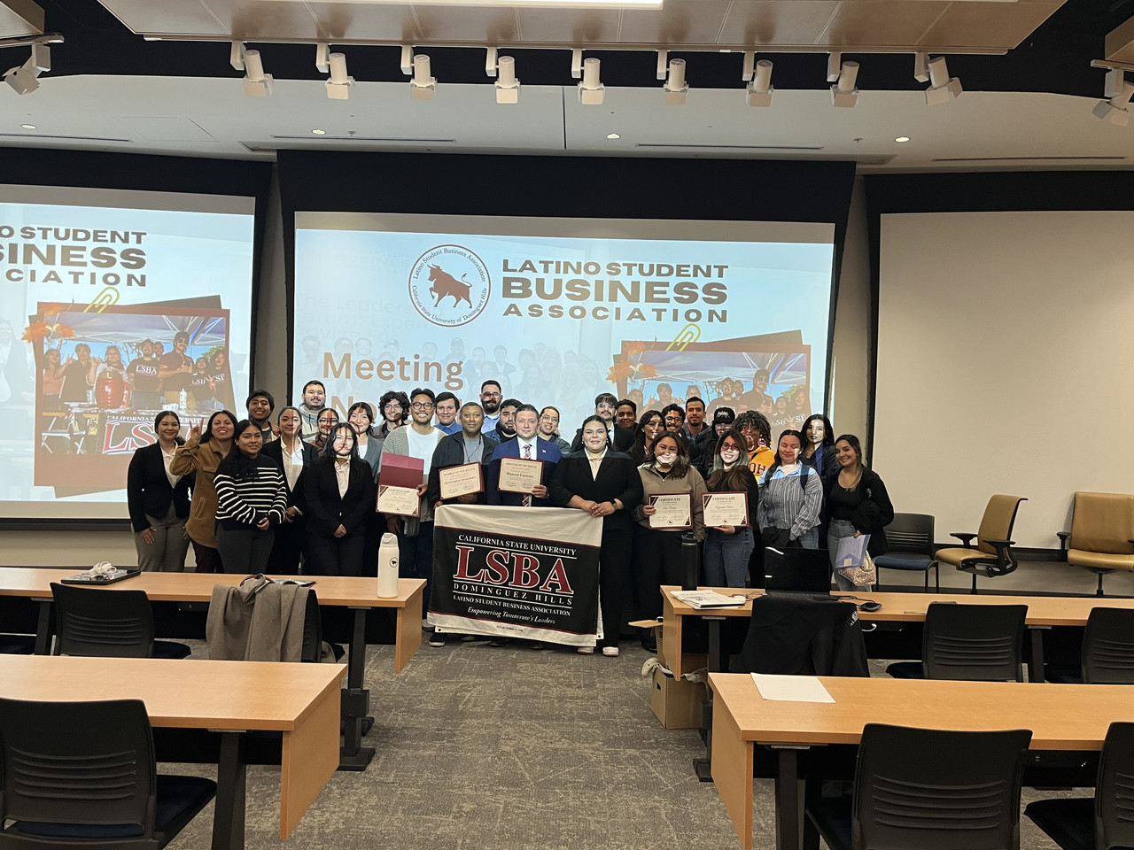 Large LSBA group in a meeting room with the LSBA banner.