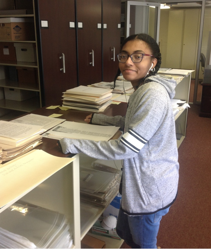 Students examining archives