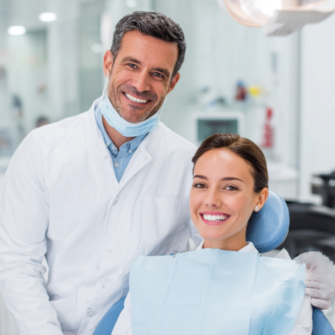Clinicasmiling-Photo-of-a-dentist-and-patient-smiling-together-cd7c2dd4-28b1-4a2e-9eb8-7a9558e38d7b