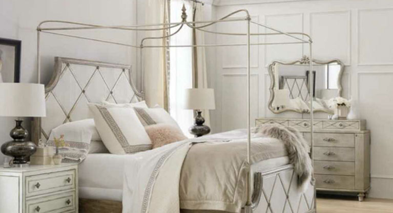 Magical, ethereal and oh-so-luxurious, the French Moderne-inspired Diamont King Bed will transport you to a sublime place. Including the headboard, footboard and rails, the bed features reverse hand-painted glass panels in a creamy white color with diamond fretwork. The diamond fretwork is in Jewel, a silver finish with rich undertones of gold and champagne. Crafted of Poplar and Hardwood Solids with Oak Veneers, silver leaf and eglomise, the headboard can be used alone if desired. Channeling jet setting socialites from the golden age of Hollywood as its muse, Hooker Furniture is set to launches a major expansion to its popular Sanctuary collection. 