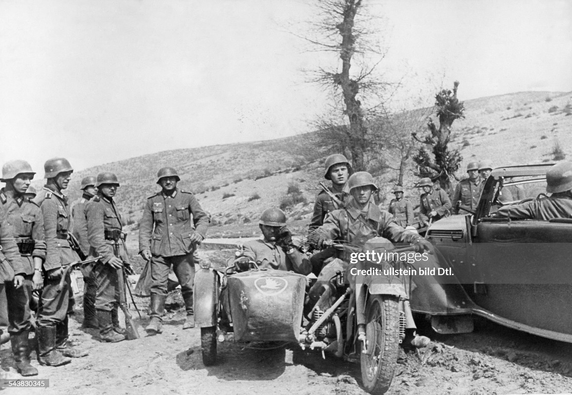 German motorcyclists of an armoured divison near Skopje (Macedonia) with a captured jugoslavian offi