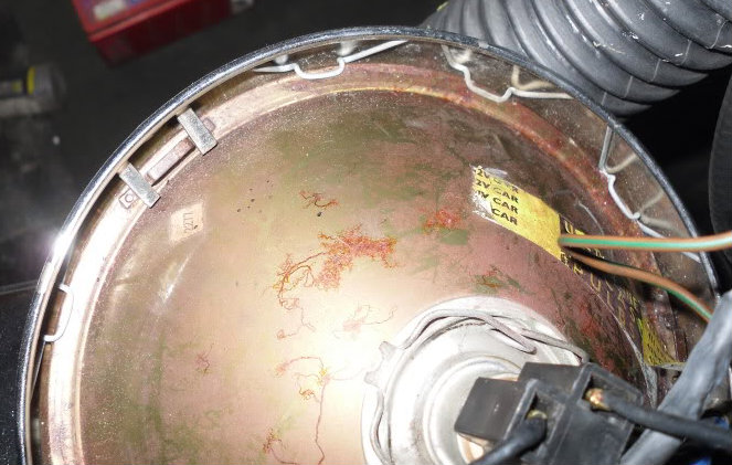 Install clips when replacing headlamp rim and glass.