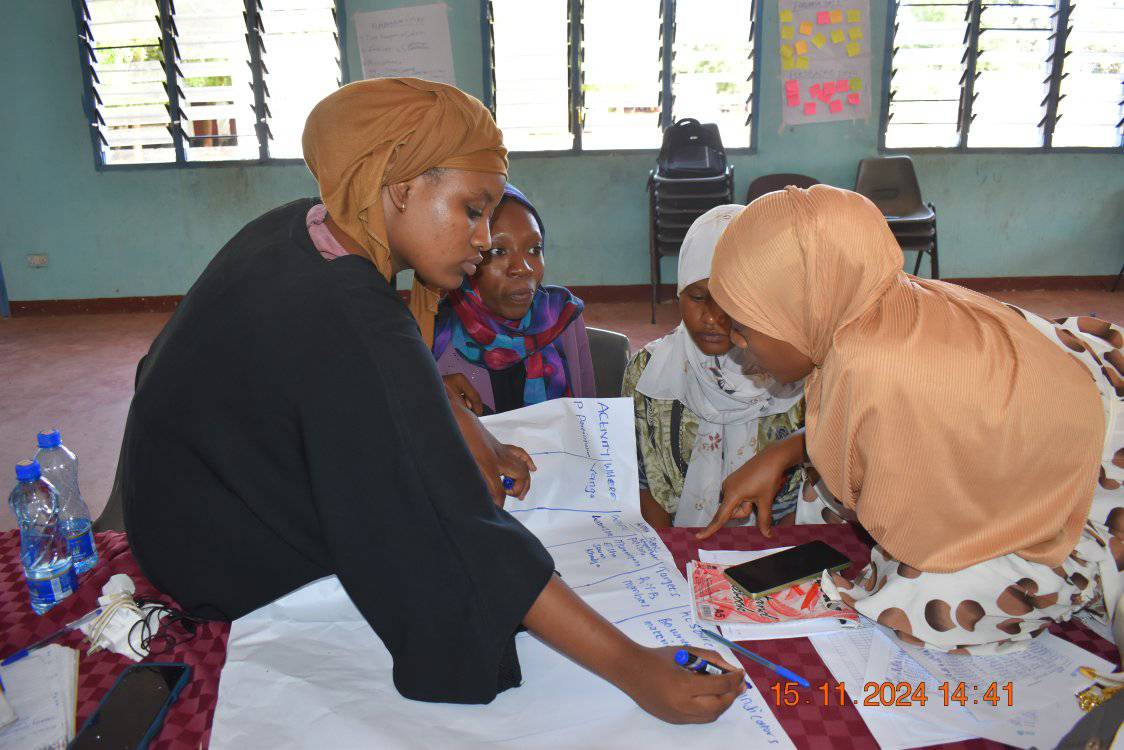 Female LYCBO members creating a chart