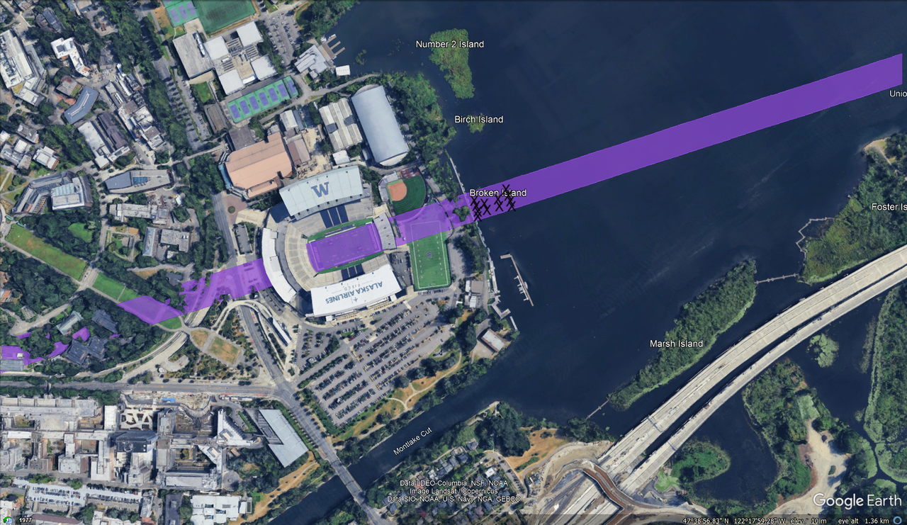 A google earth screenshot of union bay in front of husky stadium. Twelve x's mark the location of defenders on the lake.