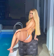 Chanel Cazzaniga, a very beautiful young blonde fitness woman with long hair, bl