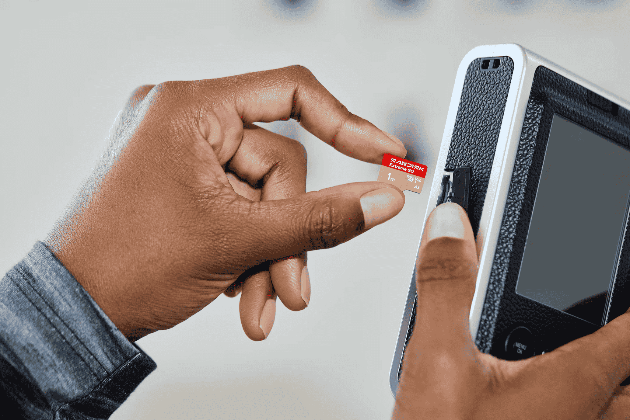 Loading a microSD card into a compact device