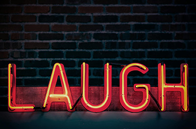 Laugh neon sign