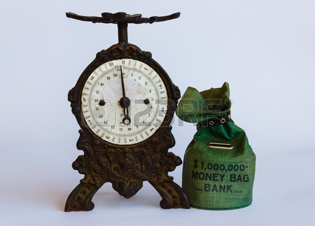 36172819-weigh-the-money-saved-in-the-piggy-bank