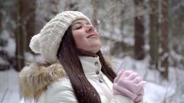 depositphotos-185510790-stock-video-girl-enjoying-snowfall-winter-forest.jpg