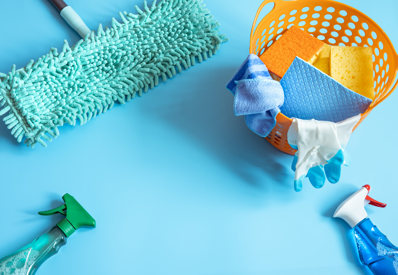 Cleaning supplies with mop, sponges, gloves and detergents