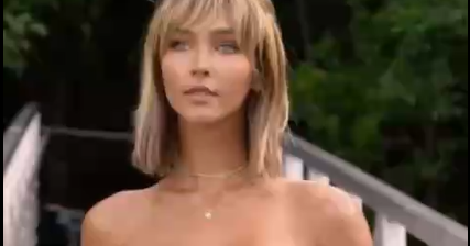 Rachel Cook A fully naked brown-haired girl standing, displaying her tits, with something leaking out of her mouth.