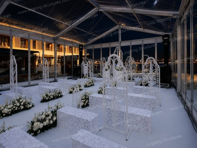 Outdoor lawn wedding tent with romantic decor and fairy lights