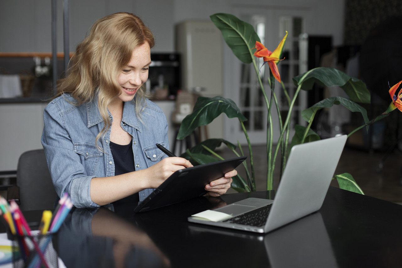 female logo designer working her office