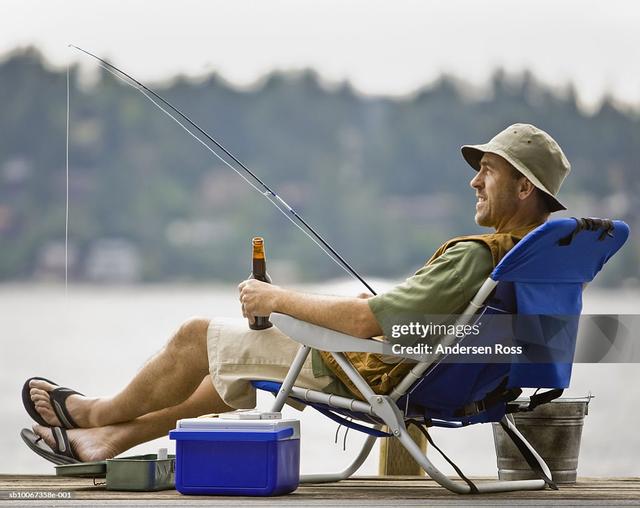 https://i.postimg.cc/MTfRVYFZ/man-fishing-at-dock-holding-beer-bottle-side-view.jpg