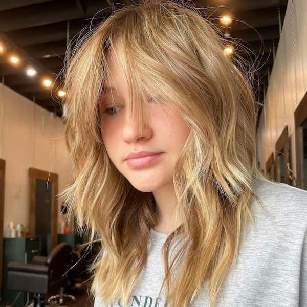Blonde long length octopus haircut for round face