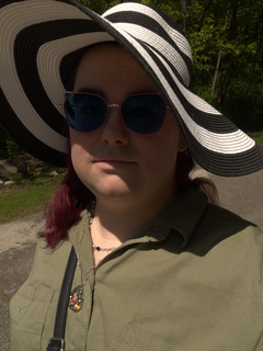 Selfie of Violet Addams in sunglasses and hat