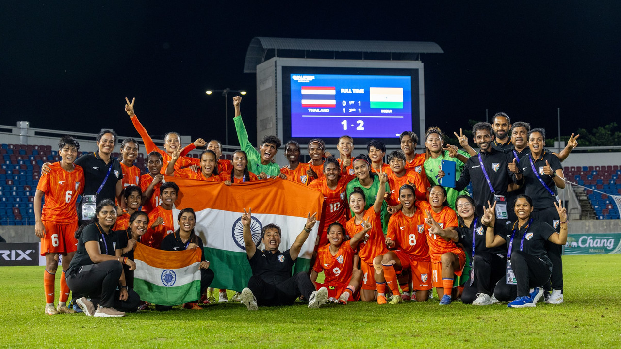 A football team in a huddle before a match.