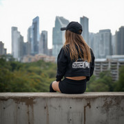 lucid-origin-Modern-2026-city-in-background-Concrete-fence-wall-in-foreground-On-it-left-si-0