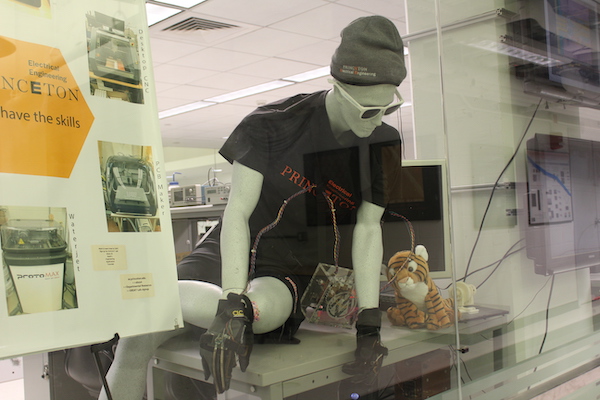 White mannequin in beanie and black t-shirt in the ECE car lab