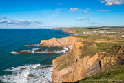 Bude cliffs with the dishes at Morwenstow in the distance.