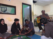 University students visiting and interacting with members of KRSI community in Malang