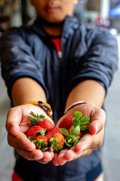 man-holding-fresh-strawberries-52369-52.jpg