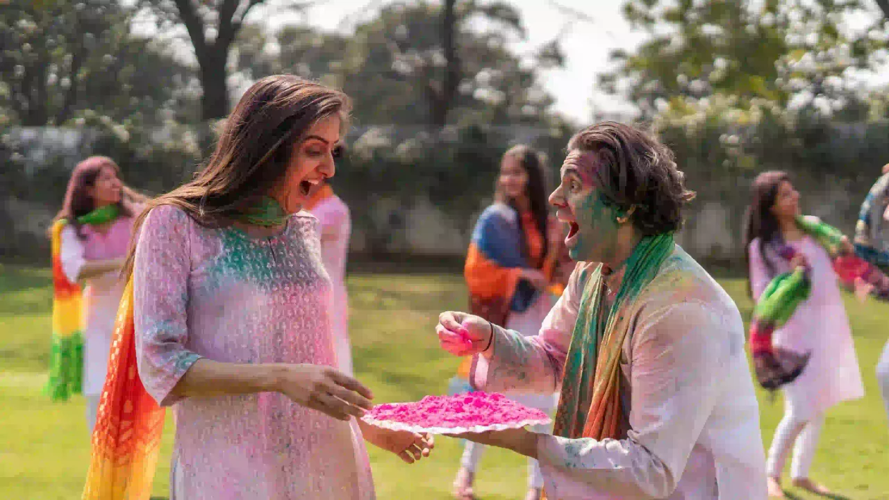 Excited Indian couple enjoying colors at Thrill Wali Holi Pushkar 2026 celebration