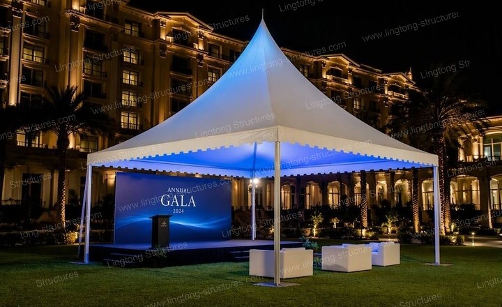Pagoda wedding marquee hosting a brand dinner with elegant lighting and setup