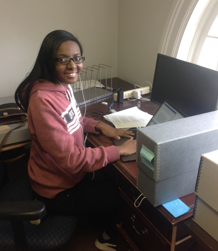Students working with archival materials