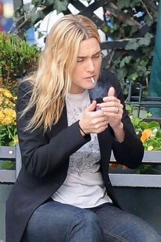 Kate Winslet smoking a cigarette (or weed)
