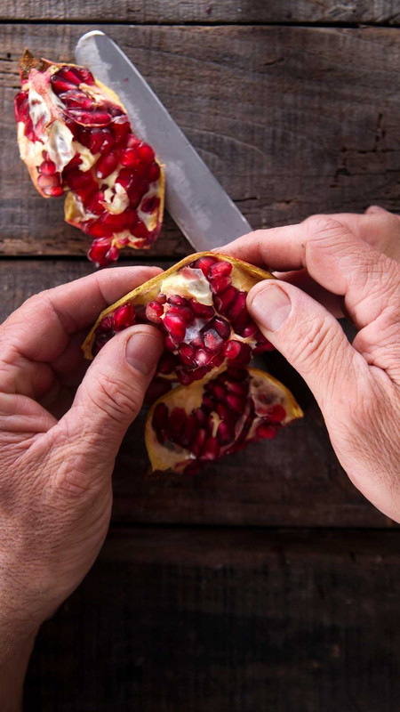 pick out all of the pomegranate seeds from the skin.