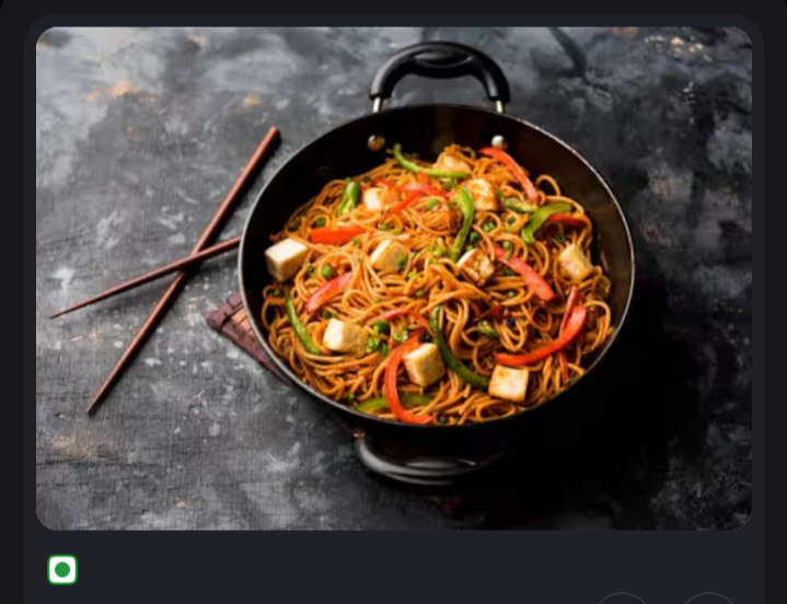 Steaming plate of chicken biryani with raita and boiled egg