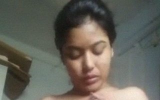 Desi beauty with a firm bust stroking her breast