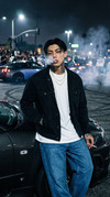 Man-leaning-against-202604062136-1