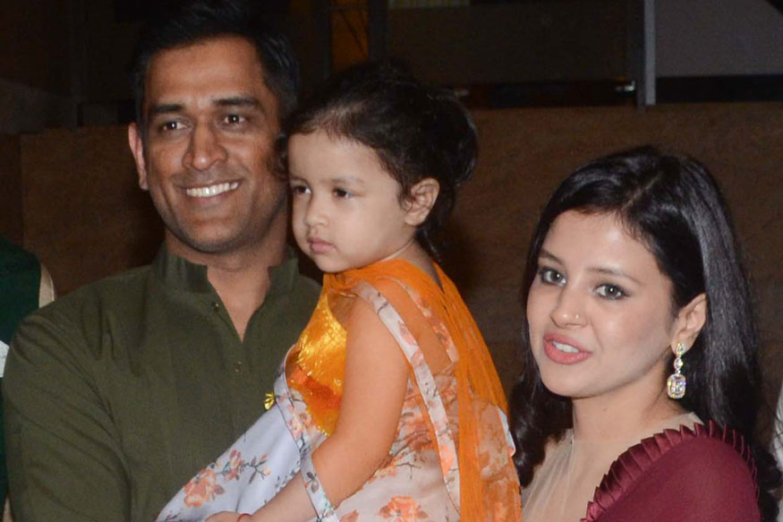 Dhoni with his wife and daughter