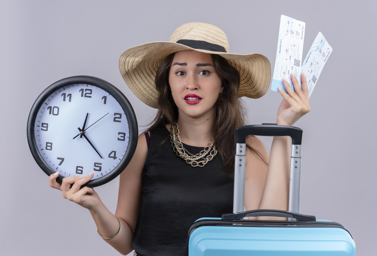 surprised-traveler-young-girl-wearing-black-undershirt-hat-holding-suitcase-tickets-white-background.jpg