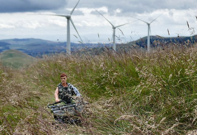 A henchmen quad biking though a place called green knowes wind farm ADF27934-08-B5-45-EC-BDC9-DE9-E51-DDAA85