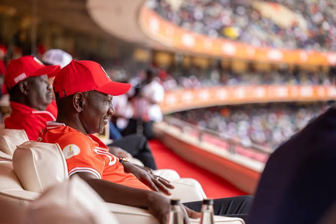 William Ruto watching football match in stadium