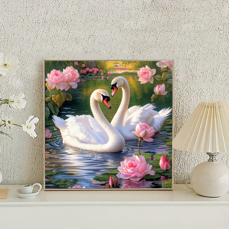twee-zwanen-met-roze-rosen.webp
