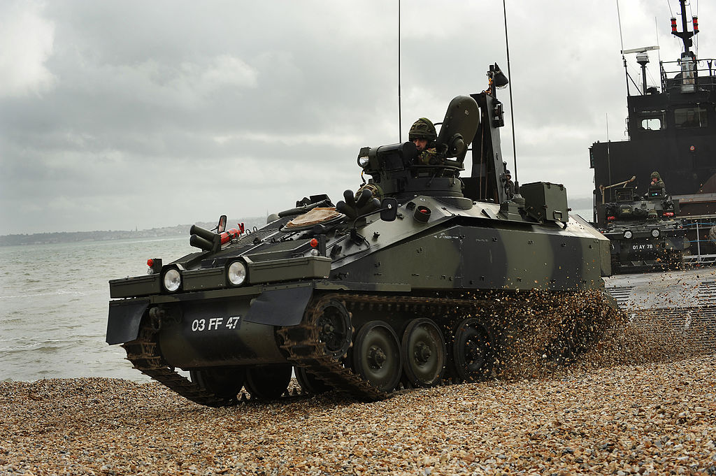 1024px-Spartan-Armoured-Personnel-Carrier-Exits-Landing-Craft-During-Amphibious-Capability-Demonstra.jpg