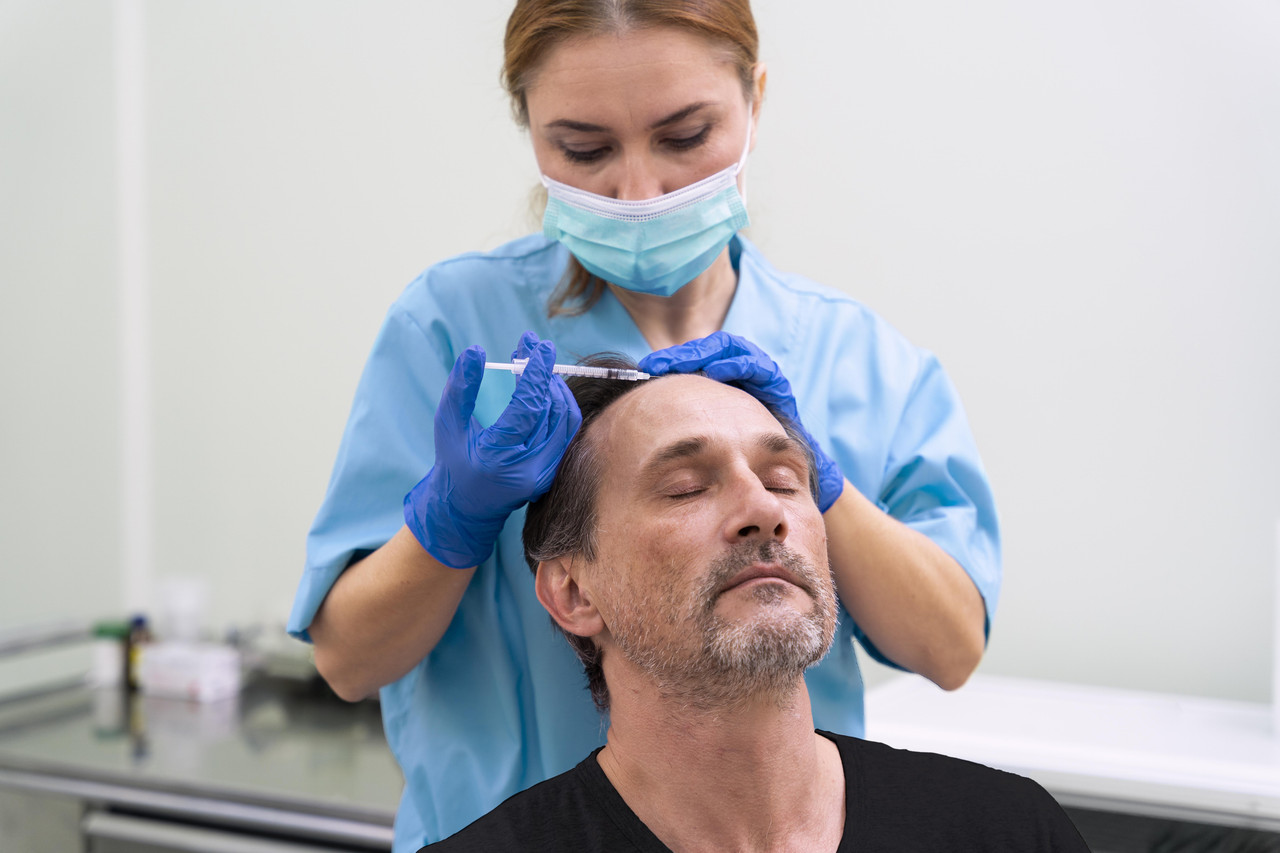 adult male getting hair loss treatment (1)