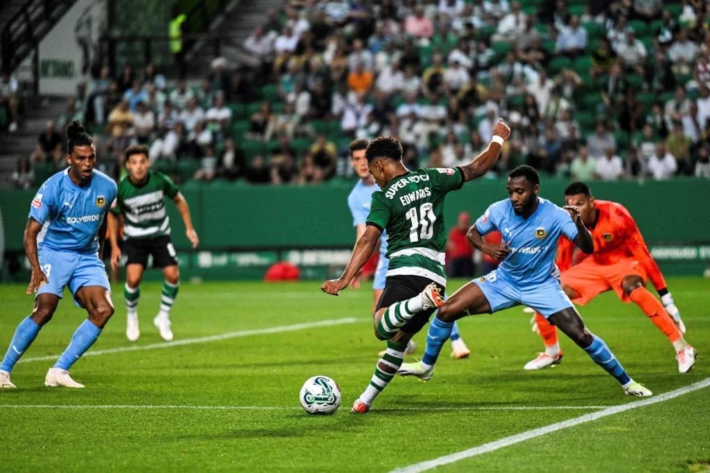 Sporting Lisbon's English forward Marcus Edwards kicks the ball and scores