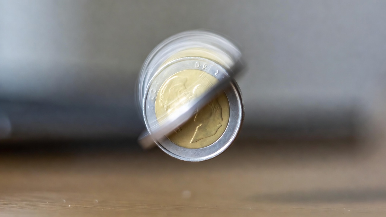 Spinning coin analogy for quantum superposition — a coin spinning in the air represents both heads and tails at once