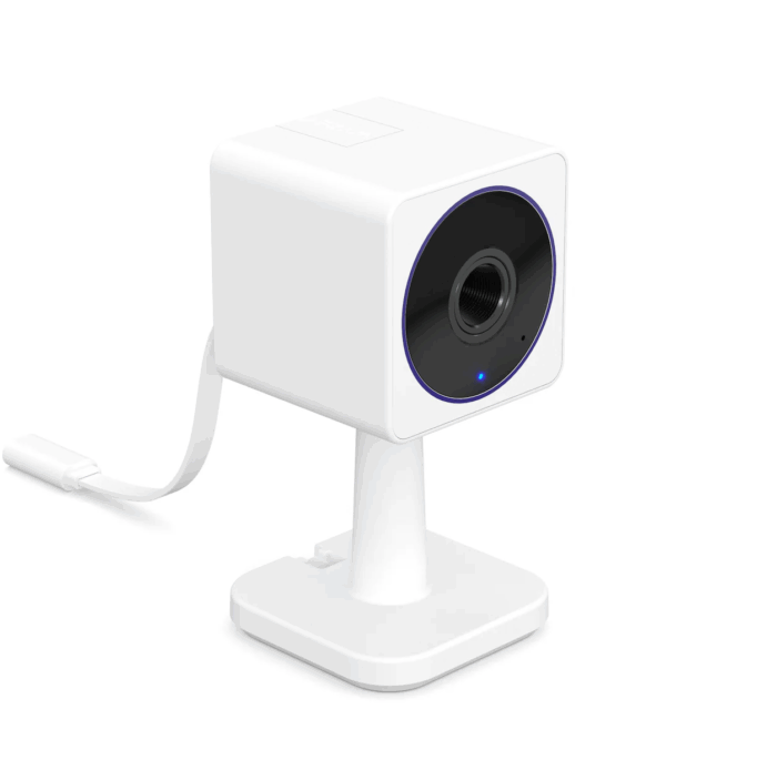 Una cámara de seguridad compacta Wyze Cam OG, destacando su diseño resistente para uso interior/exterior.