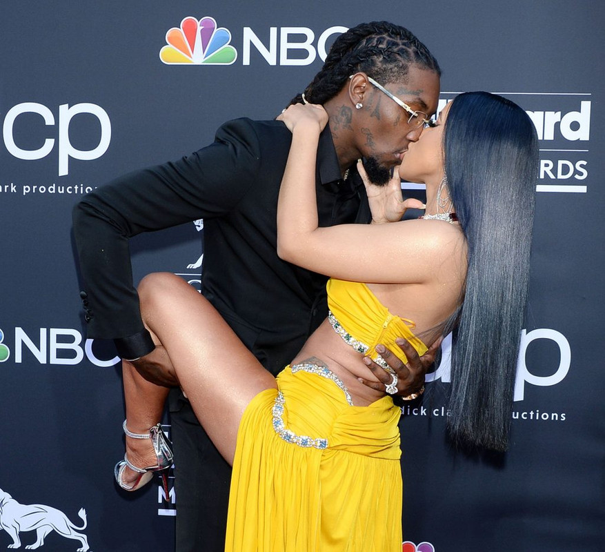 Cardi B upskirt wows in a yellow dress on the red carpet kissing with Offse...