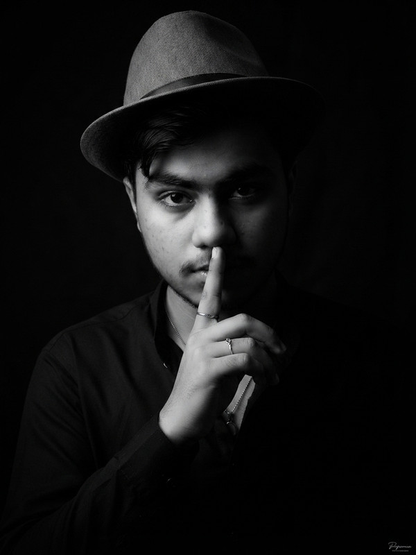 Shh Gesture Fedora AI Portrait Prompt | Black & White Prompt Craft