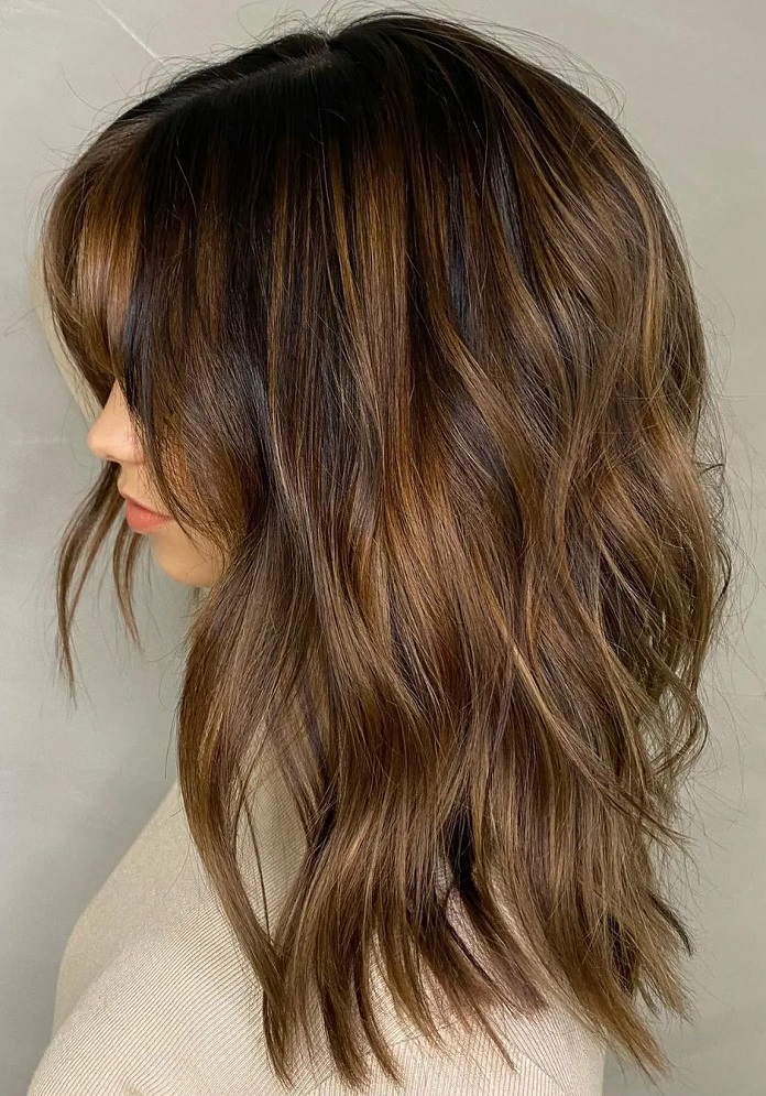 Thick shoulder length curly octopus haircut