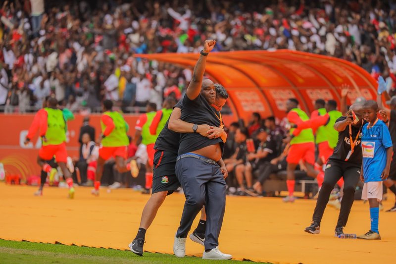 Football coach celebrating passionately on sidelines