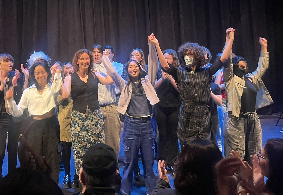 Photo of writers taking a bow